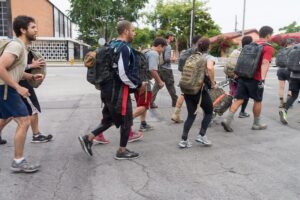 Image of people rucking together.
